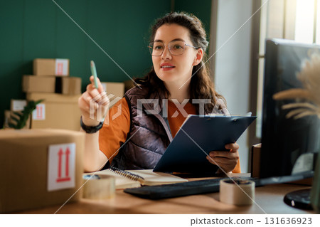 Woman working in a warehouse Woman working in a warehouse 131636923