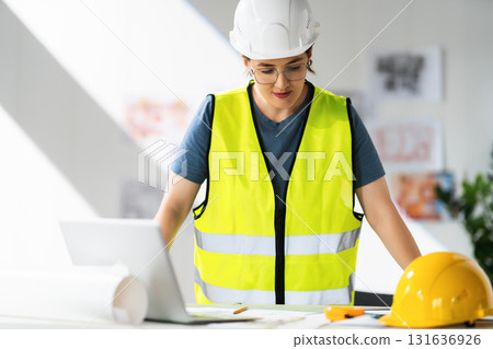 Woman architect is working on plans Woman architect is working on plans 131636926