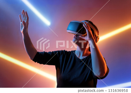 Woman with VR virtual reality goggles Woman with VR virtual reality goggles 131636958