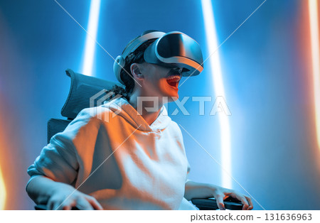 Woman with VR virtual reality goggles Woman with VR virtual reality goggles 131636963