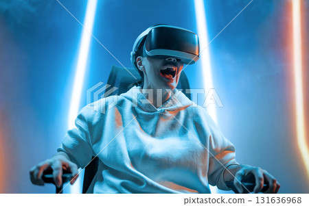 Woman with VR virtual reality goggles 131636968