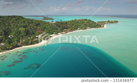 Stunning drone aerial tropical island paradise with turquoise water, lush vegetation, white sandy beaches, showcasing the beauty of nature and inviting relaxation. Stunning natural background. Stunning drone aerial tropical island paradise with turquoise water, lush vegetation, white sandy beaches, showcasing the beauty of nature and inviting relaxation. Stunning natural background. 131636977