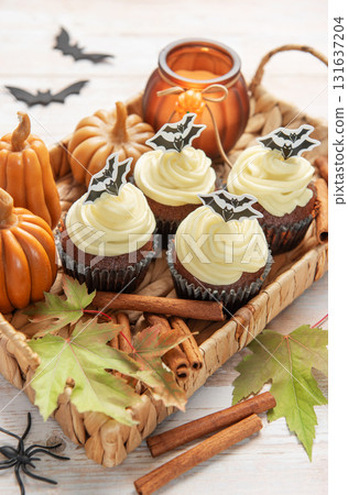 Halloween cupcakes with bat decoration and autumn elements Halloween cupcakes with bat decoration and autumn elements 131637204