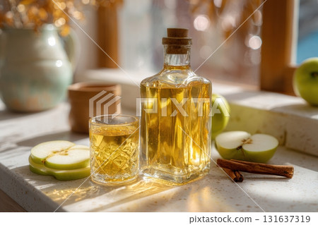Fermented apple cider drink in a glass and bottle 131637319