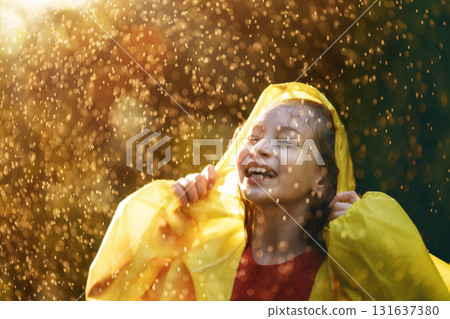 girl in the rain on an autumn walk 131637380