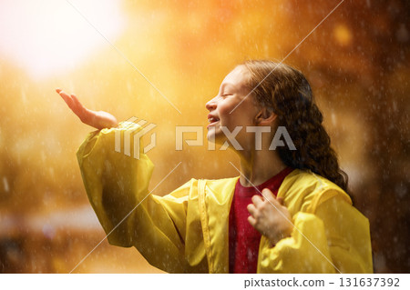 girl in the rain on an autumn walk 131637392