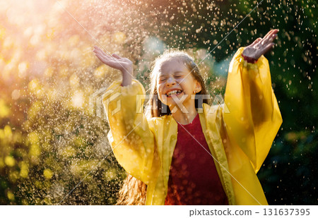 girl in the rain on an autumn walk girl in the rain on an autumn walk 131637395