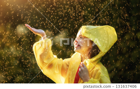 girl in the rain on an autumn walk girl in the rain on an autumn walk 131637406