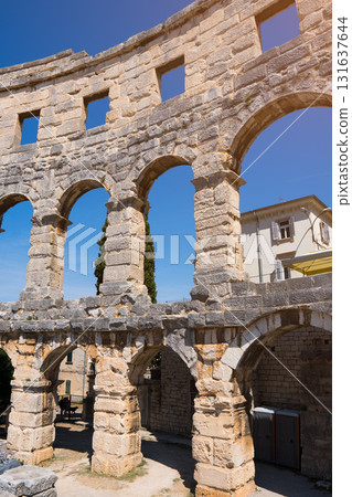 Pula Roman amphitheater architecture with clear blue sky 131637644