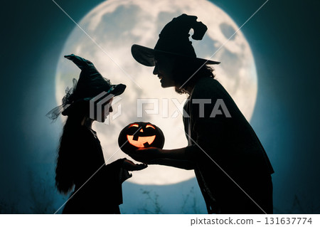 Woman and child holding a roast turkey together 131637774