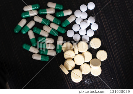 Money and pills, health pill tablet cash dollar capsule pharmaceutical Money and pills, health pill tablet cash dollar capsule pharmaceutical 131638029