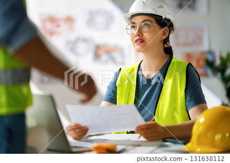 Team of architects working on plans Team of architects working on plans 131638112