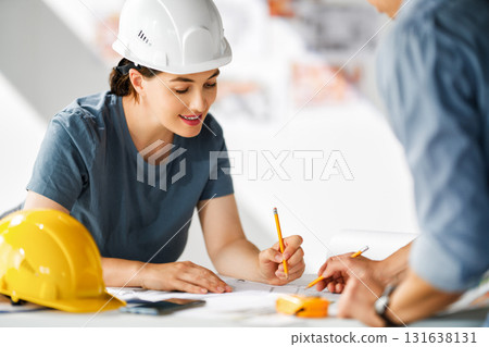 Team of architects working on plans Team of architects working on plans 131638131