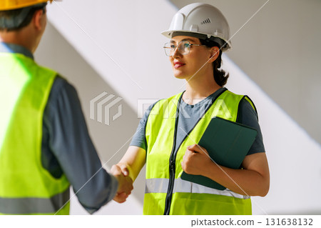 Team of architects working on plans Team of architects working on plans 131638132
