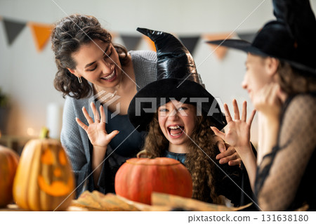 Happy family preparing for Halloween. Happy family preparing for Halloween. 131638180