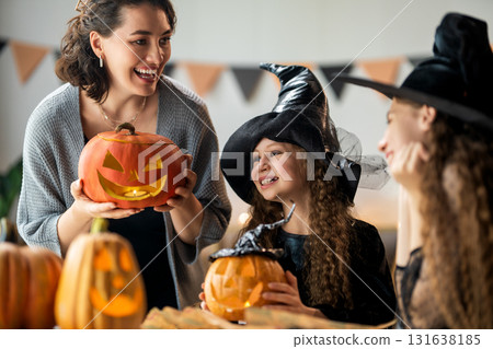 Happy family preparing for Halloween. Happy family preparing for Halloween. 131638185