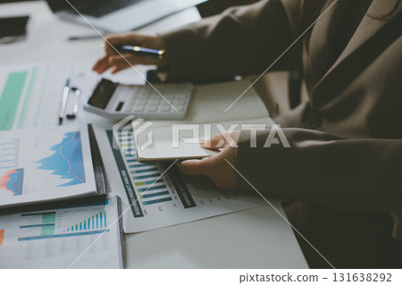 Portrait of young Hispanic professional business woman standing in office. Happy female company executive, smiling businesswoman entrepreneur corporate leader manager looking at camera using tablet Portrait of young Hispanic professional business woman standing in office. Happy female company executive, smiling businesswoman entrepreneur corporate leader manager looking at camera using tablet 131638292
