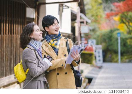 Sightseeing couple Autumn leaves image 131638443