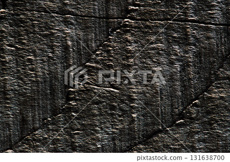 Deep furrows and cracks create a multi-layered wood texture 131638700