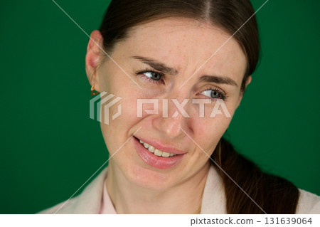 Set of photos of young European woman in light blazer and blue jeans showing various emotions gestures and expressions on green chroma key background with copy space for advertising and social media Set of photos of young European woman in light blazer and blue jeans showing various emotions gestures and expressions on green chroma key background with copy space for advertising and social media 131639064