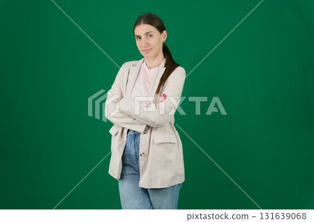 Set of photos of young European woman in light blazer and blue jeans showing various emotions gestures and expressions on green chroma key background with copy space for advertising and social media Set of photos of young European woman in light blazer and blue jeans showing various emotions gestures and expressions on green chroma key background with copy space for advertising and social media 131639068
