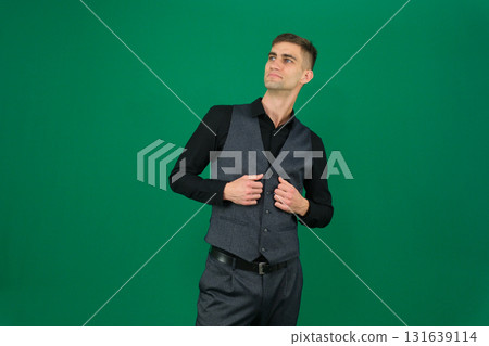 Set of videos with handsome European businessman in classic suit vest and black shirt showing different emotions gestures and confident poses on green chroma key background with copy space 131639114