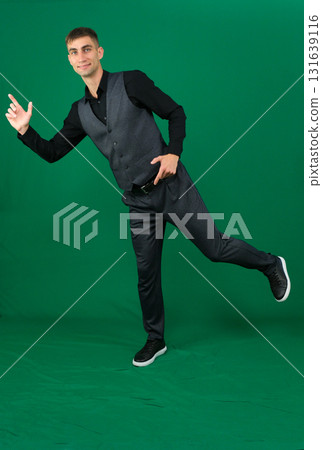 Set of videos with handsome European businessman in classic suit vest and black shirt showing different emotions gestures and confident poses on green chroma key background with copy space 131639116