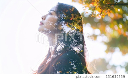 Woman looking diagonally upwards Woman looking diagonally upwards 131639339