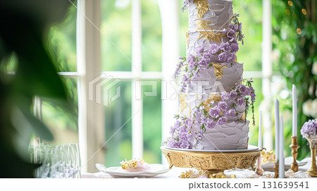 Wedding table decoration with lavender flowers, sweets and cake Wedding table decoration with lavender flowers, sweets and cake 131639541