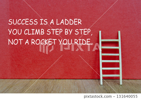 A wooden ladder with text SUCCESS IS A LADDER YOU CLIMB STEP BY STEP, NOT A ROCKET YOU RIDE, symbolizing perseverance and gradual progress. 131640055
