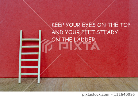 A red background with a wooden ladder and motivational text KEEP CLIMBING EVEN WHEN THE TOP SEEMS FAR AWAY representing persistence and determination. 131640056
