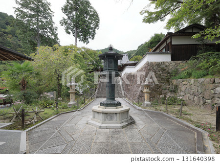 A bronze lantern on the approach to the main hall from the gate of Zenpo-ji Temple, the 20th temple of the Thirty-three Kannon Temples of the Saigoku Kannon Pilgrimage (the rest area is on the top right) A bronze lantern on the approach to the main hall from the gate of Zenpo-ji Temple, the 20th temple of the Thirty-three Kannon Temples of the Saigoku Kannon Pilgrimage (the rest area is on the top right) 131640398