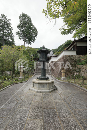 A bronze lantern on the approach to the main hall from the gate of Zenpo-ji Temple, the 20th temple of the Thirty-three Kannon Temples of the Saigoku Kannon Pilgrimage (the rest area is on the top right) A bronze lantern on the approach to the main hall from the gate of Zenpo-ji Temple, the 20th temple of the Thirty-three Kannon Temples of the Saigoku Kannon Pilgrimage (the rest area is on the top right) 131640399
