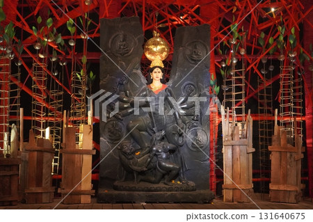 Mahisasuramardini Goddess Durga with Divine Family and Ornate Backdrop 131640675