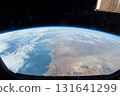 View of Earth from space captured during low-light conditions showcasing urban lights and natural atmosphere 131641299