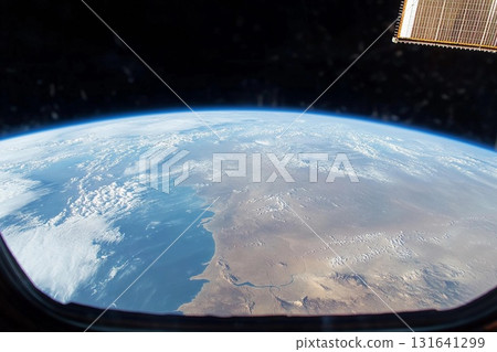 View of Earth from space captured during low-light conditions showcasing urban lights and natural atmosphere 131641299