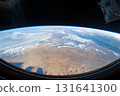 View of Earth from space captured during low-light conditions showcasing urban lights and natural atmosphere 131641300
