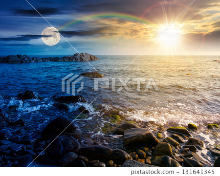 pebble coast. day and night time change concept. beautiful summer vacation season at the sea  with sun and moon at twilight 131641345