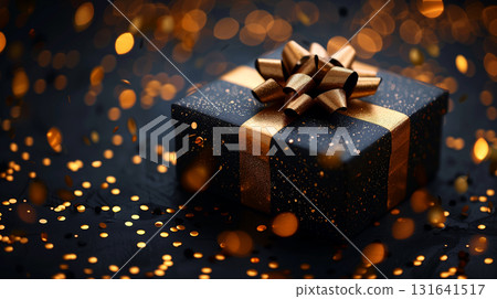 Luxury black gift box with golden ribbon and festive bokeh lights 131641517