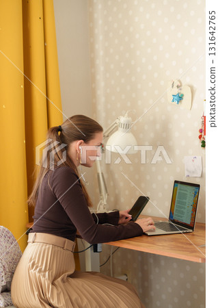 Woman working remotely at home 131642765