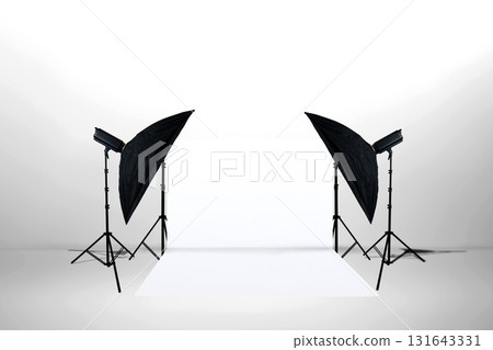 Minimalist studio lighting setup with softbox lights, stands, and a white backdrop. Copy space. Product shooting, e-commerce, portrait, and general studio. Professional setup for showcasing products Minimalist studio lighting setup with softbox lights, stands, and a white backdrop. Copy space. Product shooting, e-commerce, portrait, and general studio. Professional setup for showcasing products 131643331