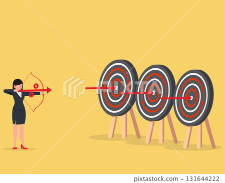 Perfection. business woman shooting target and achieve business goals Perfection. business woman shooting target and achieve business goals 131644222