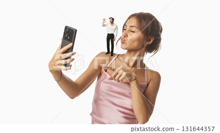Trendy graphic composition. Woman taking selfie with tiny man on her shoulder 131644357