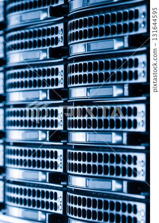 Cluster of data storage hard drives inside server room Cluster of data storage hard drives inside server room 131644595