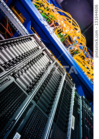 cluster of data storage SSD hard drives inside server rack 131644606