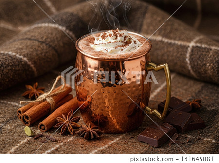 Cozy Winter Hot Chocolate in a Polished Copper Mug with Whipped Cream and Spices 131645081