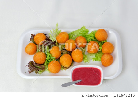 Cheese balls salad Fried cheese sticks in pan with rosemary 131645219