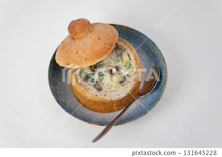 Homemade Broccoli Cheddar Soup in a Bread Bowl Ready to Eat Homemade Broccoli Cheddar Soup in a Bread Bowl Ready to Eat 131645228