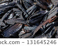 Burned and carbonized husks from newly threshed rice 131645246