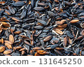 Burned and carbonized husks from newly threshed rice 131645250